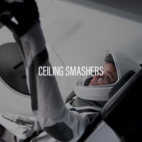 Astronaut inside a spacecraft raising an arm with the words ‘Ceiling Smashers’ displayed.