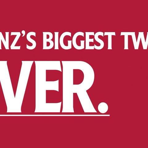 Red Heinz-branded mini fridge opened to reveal bottles of tomato ketchup and fresh tomatoes inside.