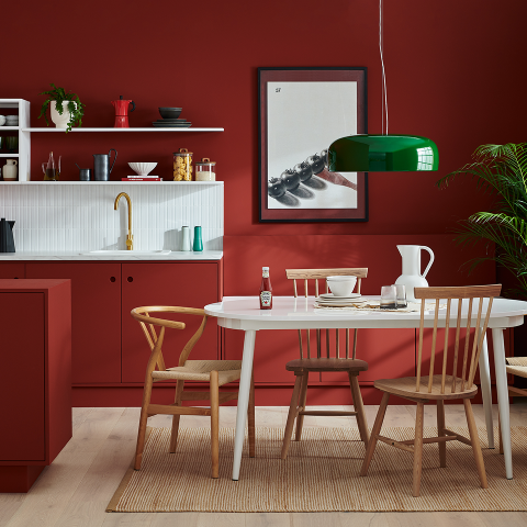 Tabletop display showing Lick paint tin and Heinz Tomato Ketchup bottle in a red kitchen setting.